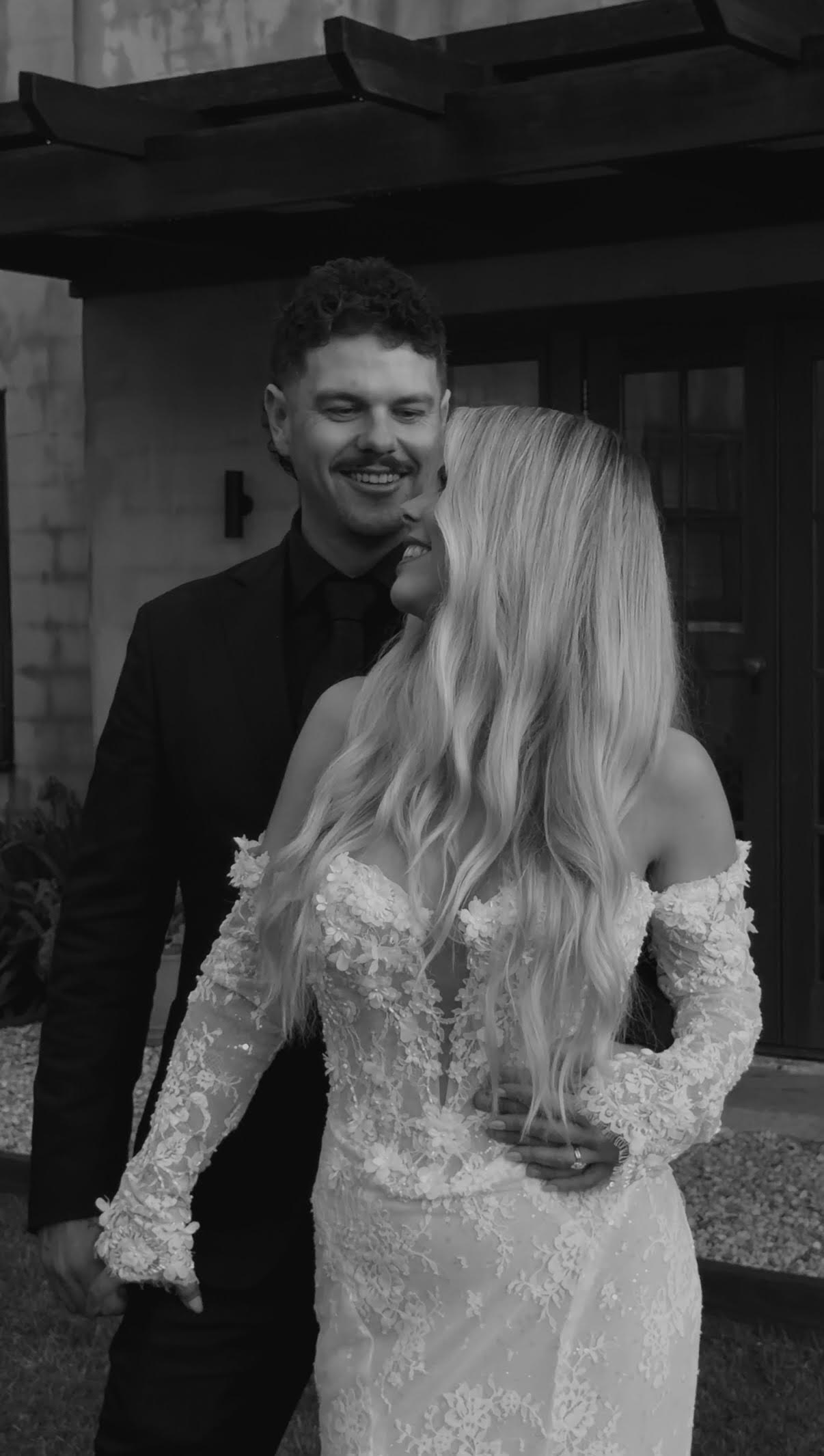 Bride and Groom embracing each other during a photoshoot.